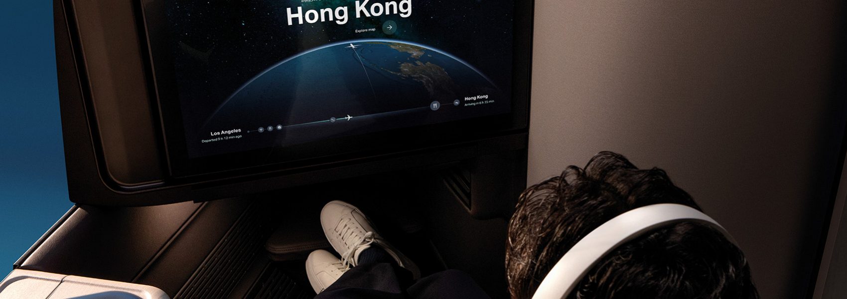 Passenger seated in Cathay Pacific's Aria Suite